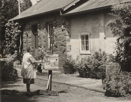 Alma Figuerola painting in her garden at D'Estaville