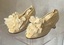 Pair of leather soled silk wedding shoes