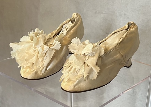Pair of leather soled silk wedding shoes