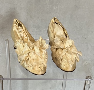 Pair of leather soled silk wedding shoes