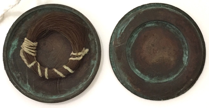 Lock of hair of Thomas Henty  (1775-1839) in a hollowed Cartwheel Penny