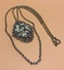 Gold-coloured chain and medallion