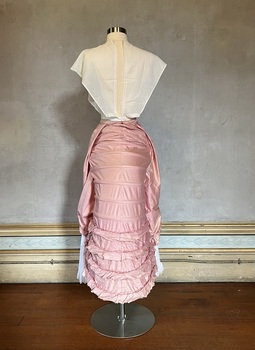 Pink lobster-tail bustle