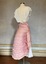 Pink lobster-tail bustle