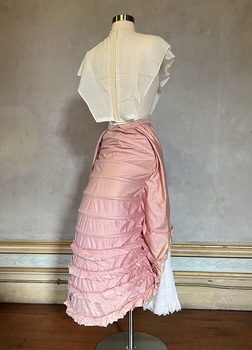 Pink lobster-tail bustle