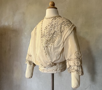 Ivory silk and lace wedding dress [bodice]