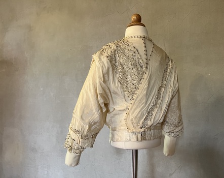 Ivory silk and lace wedding dress [bodice]
