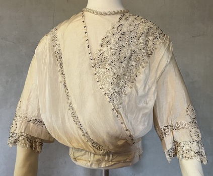 Ivory silk and lace wedding dress [bodice]