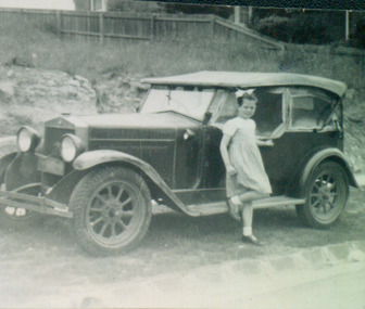 Jane Coade and the family car outside 52 Frater Street, Kew East
