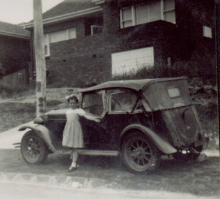 Photograph - Jane Coade and the family car outside 52 Frater Street, Kew East, 1953