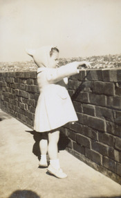 Jane Coade on the veranda of 52 Frater Street, Kew East