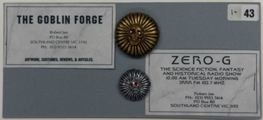 2 buttons and 2 cards on grey card, 1999