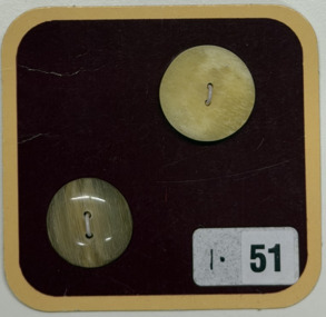 2 buttons on brown card, c. 2004