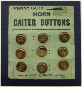 9 buttons on commercial card on blue card, 1920s