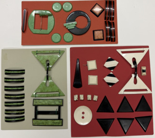 3 cards - red, green, orange numerous buttons and shackles, Unknown