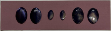 6 buttons on pink card, 1910s
