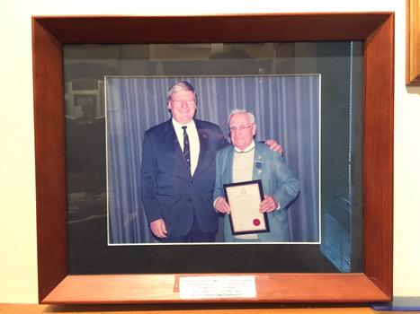 Combined Tramways/ East Melbourne Sub-Branch Member Eddie Brogan with the award and certificate of the RSL Meritorious Service Medal  with Sub - branch president Peter Fraser at the RSL Victoria Branch State Conference 2007.  This information is taped onto the exterior of the frame.  