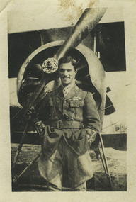 soldier posing infront of aeroplane
