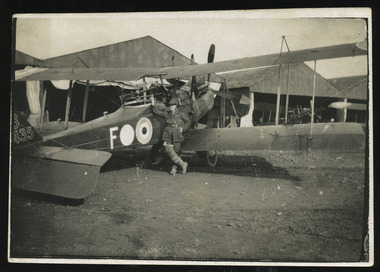 soldier posing with plane