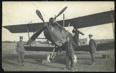 soldiers posing with plane