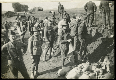 soldiers filling sandbags