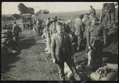 soldiers filling sandbags