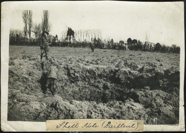 soldiers in shell hole