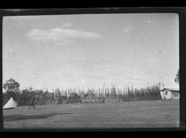 soldier walking in camp, les chandler_a00063.tif