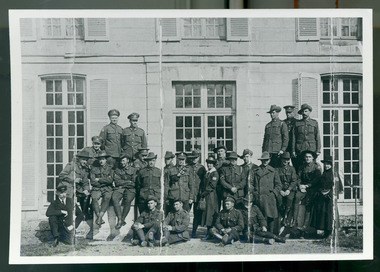 group soldiers posing with nurse