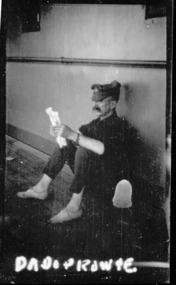 soldier reading paper, les chandler_a00181.tif