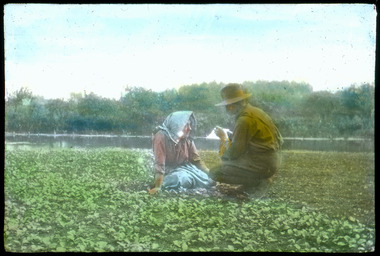 soldier with woman in field, les chandler_a00210.tif