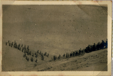 Soldiers marching up hill, red cliffs 00107.tif