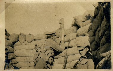 officer looking over trench with periscope, red cliffs military 00008.tif