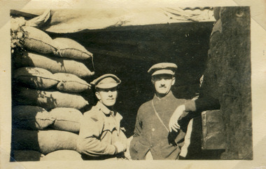 Photograph of two soldiers in a trench dugout, red cliffs military00016.tif