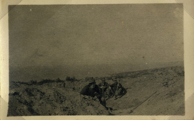 Soldiers resting in half dug trench