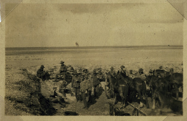 Soldiers resting in desert