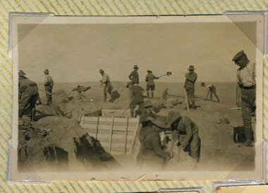 Soldiers digging trench