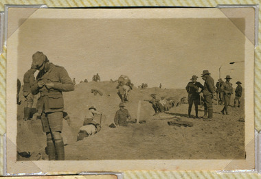 Soldiers digging trench