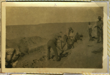 Soldiers digging trench