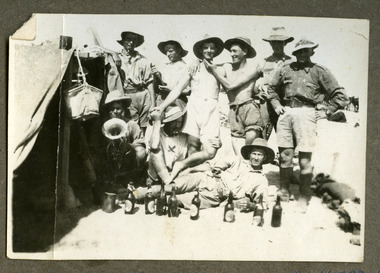 A group of soldiers enjoy a few beers in camp, robertson thomas104.tif