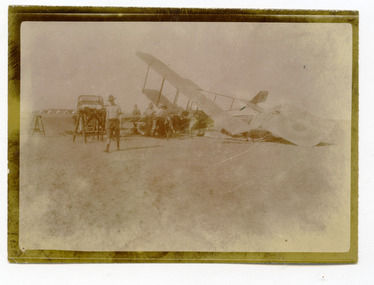 soldiers working on wrecked aeroplane, robertson thomas137.tif