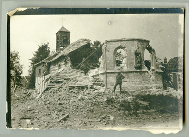 soldier posing infront of ruined church, robertson thomas173.tif