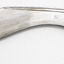 Metal blade, curved large dagger with dark brass handle. Side view on white background