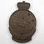 Bronze medal with southern cross stars and map of Australia, with crown crest on top and wreath underneath, engraving reads: W. J. Bentley. Lying flat on white background