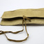 Canvas rectangle wallet/roll, closed, on white background, two fold with two ribbon fastener.