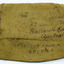 Khaki fabric, rectangular shape, with handwritten text in black ink, showing Ballarat East address, like an envelope. Also has official postage ink stamps, one red ink, one black.. 