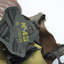 Back of gas mask is black rubbber head straps with black, red and white striped strapping. Yellow printed inscription on four-point connecting rubber piece, reads: N-4II / ML M MAY 39