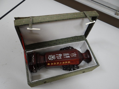 Urn in a green box