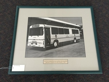 Photograph, framed, One of two Leyland Met buses modified with rear loading, ramp and 12 stretchers for major disasters - 1988