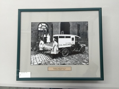 Photograph, framed, Unloading T Model Ford no.3, at St Vincent's Hospital circa 1920